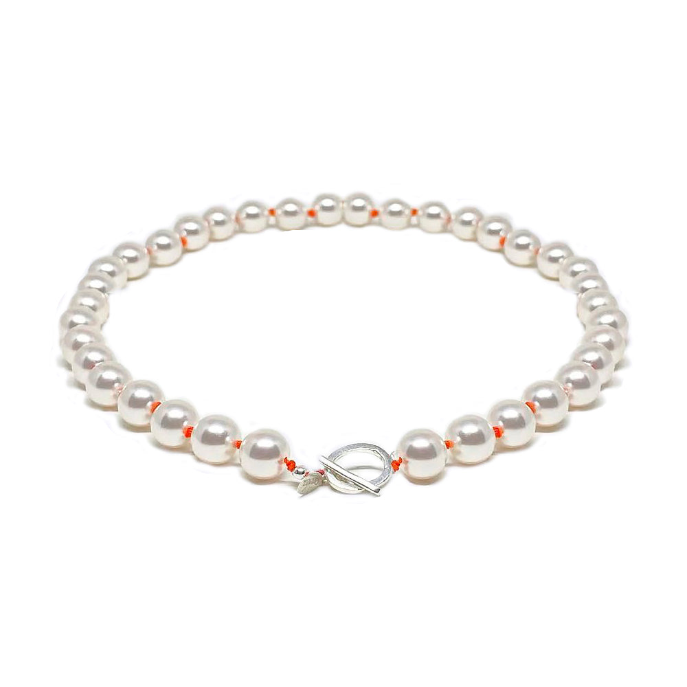 Pearls necklace and orange knots necklace with silver clasp.