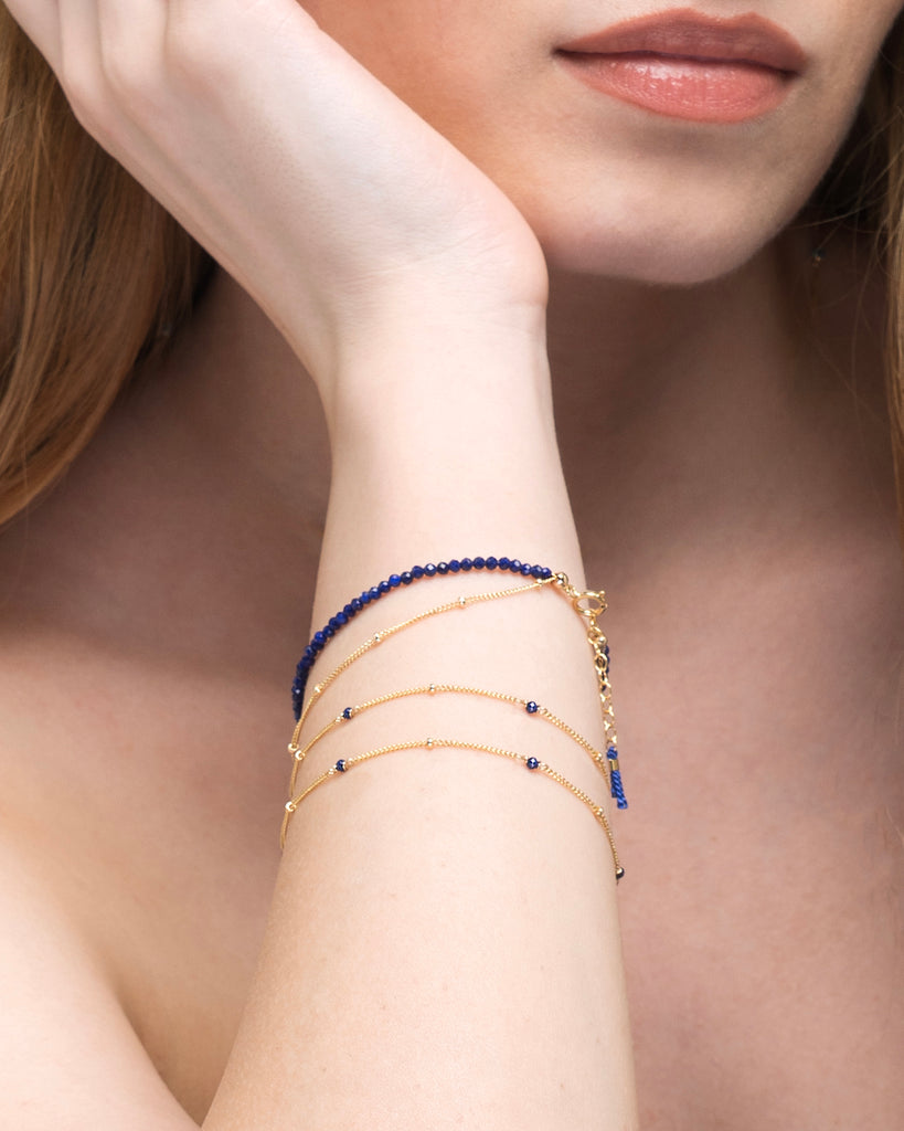 lapis lazuli gold bracelets with silk tassel by Desideri design